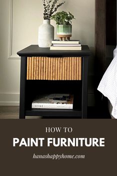 a nightstand with books, vase and flowers on it