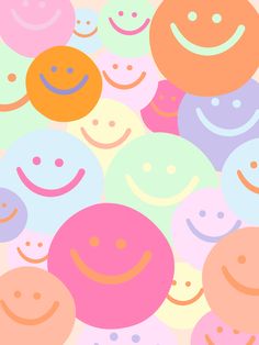 many different colored smiley faces on a white background