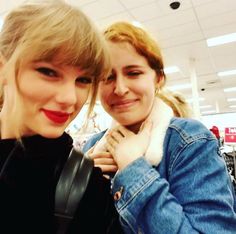 two women standing next to each other in a store