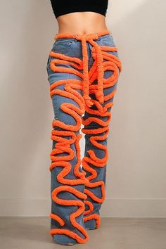 Embrace your daring fashion sense with these striking denim pants, a bold choice for those who crave attention. The timeless blue denim acts as a canvas for the dynamic orange piping that dances along the legs in a winding, organic motif. Not only does it inject a pop of color, but it also creates a sense of motion and texture. The high-waisted design flatters your form, while the sleek silhouette tapers towards the ankles, accentuating your curves. Suitable for casual occasions or bold enough f Orange Denim Bottoms For Spring, Spring Orange Denim Bottoms, Fitted Orange Bottoms For Streetwear, Fitted Orange Bottoms For Winter, Crave Attention, Bodysuit Blouse, Bandage Dress Bodycon, Snake Patterns, Bold Style