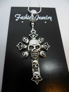 "This is a lovely skull cross themed pendant necklace. The cross is approx. 3cm long x 2cm wide. On an 18\" silver plated snake chain. Thanks for looking!!" Halloween Gift Necklace With Cross Pendant, Halloween Gift Cross Pendant Necklace, Gothic Silver Necklace With Skull Print, Silver Cross Jewelry For Halloween, Nickel-free Metal Cross Pendant Necklace, Halloween Silver Jewelry With Cross Pendant, Silver Cross Pendant Jewelry For Halloween, Punk Style Silver Cross Pendant Jewelry, Silver Cross Necklace For Halloween