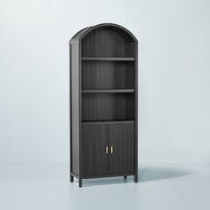 a black bookcase with two doors on each side