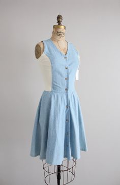 "Vintage chambray tea dress with stretch back and sides, fitted waist, button front, side pockets, and full skirt. Made by Banana Republic. Fits Like: Small Circa 1990s Fabrication: 100% cotton Condition: excellent! Measurements: 32-34\" bust | 26\" waist | full hips | 17\" bodice length | 37\" length" Stretch Back, Dress Denim, Chambray Dress, Tea Dress, Full Skirt, Chambray, Denim Dress, Banana Republic, Bodice