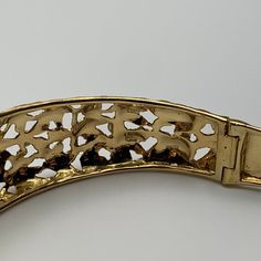 This is part of Chairish’s Fine Jewelry assortment.  This bangle is hand-crafted out of 18 karat yellow gold. It features delicate, florentine engravings of leaves and small flowers. The clasp contains one safety clasp.   Weight: 17.75g Size: 6.5" Luxury Yellow Gold Hinged Bracelet, Ornate Gold Bangle For Anniversary, Ornate Gold Bangle Bracelet For Formal Occasions, Luxury Hinged Yellow Gold Bracelet, Elegant Engraved Metal Bangle, Ornate Yellow Gold Cuff Bracelet For Formal Occasions, Ornate Gold Cuff Bracelet For Anniversary, Luxury Gold Metal Bracelet For Wedding, Evening Hinged Bangle Jewelry