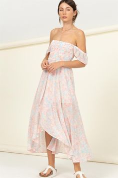 SHOW OFF YOUR TRUE COLORS IN THIS MIDI DRESS THAT CONSTRUCTS A FLORAL PRINT WITH AN OFF-THE-SHOULDER NECKLINE, A FITTED, SMOCKED BODICE THAT CASCADES INTO A FLARED, OVERLAPPING ASYMMETRICAL MIDI HEM. RUFFLE DETAILING ON THE SLEEVES. 100% POLYESTER IMPORTED. DESIGNED IN THE USA MODEL IS 5' 7" TALL, 32" CHEST, 23" WAIST AND 34" HIPS AND WEARING A SIZE SMALL Smocked Dress For Women, Cascading Dress, Sunset Walk, Asymmetrical Midi Dress, Dress Colors, Yellow Midi Dress, Smocked Dress, Pink Midi Dress, Pastel Floral