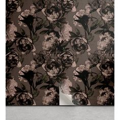 a floral wallpaper with black and white flowers on a dark grey background is shown