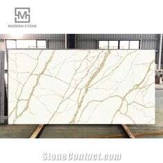 white marble with gold veining on the top and bottom, in an industrial area