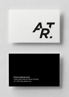 two business cards with black and white letters on them, one has the letter ar