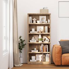 a living room with a brown leather chair and bookshelf