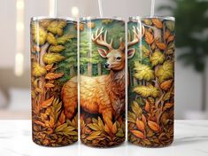 three glasses with deer images painted on them