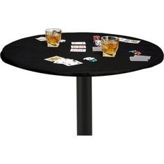 a table with two glasses and cards on it