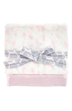 the pink and white blanket has a bow on it