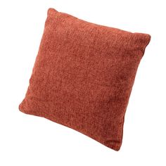 an orange pillow on a white background