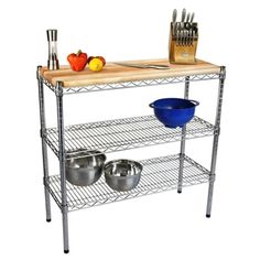 a stainless steel shelf with two bowls and utensils on the top, next to a cutting board