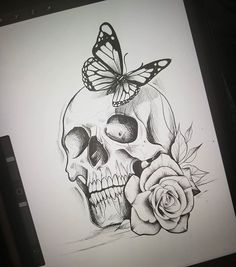 a drawing of a skull with a butterfly on it's head and a rose