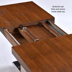 a wooden table with two drawers on each side and one drawer open to show the bottom