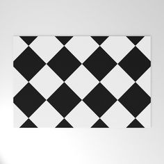 a black and white checkerboard pattern is on the wall