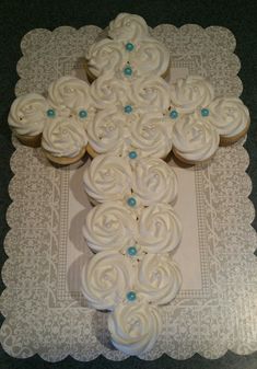 cupcakes are arranged in the shape of a cross