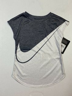 Nike Girls Athletic Cut Dri-Fit Shirt Size 6X NWT. Nike Cotton Short Sleeve Tops, Nike Gray Cotton Tops, Nike Gray Tops With Logo Print, Nike Gray Top With Logo Print, Gray Cotton Sports Tops, Fitted Nike Cotton T-shirt, Nike Fitted Cotton T-shirt, Nike Summer Gray Tops, Nike Gray Summer Tops