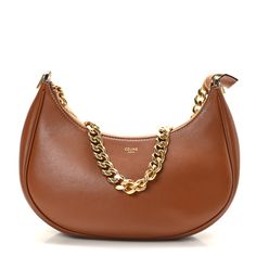 This is an authentic CELINE Smooth Calfskin Medium Chain Strap Ava Shoulder Bag in Tan. This chic bag is crafted of brown leather. The bag features a gold chain shoulder strap and gold hardware. The top zipper opens to a brown suede interior with a patch pocket. Chic Bags, Bag Light, Black Cross Body Bag, Flap Bag, White Bag, Brown Suede, Chain Strap, Belt Bag, Gold Hardware