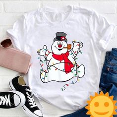 a snowman wearing a top hat and scarf with christmas lights on it's chest