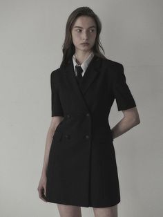 The slim fit jacket dress that made of lightweight spring fabric. Featuring the double-breasted closure with black-silver toned buttons, and its slim silhouette and mini length. We recommend style with shirts or scarf to create unique school look. - Notched lapel collar and half-sleeved design- Double-breasted closure- Black-silver buttons detail- Flap pockets and seam line detail at front- Slim and fitted silhouette, mini length- Lightweight polyester fabric for spring- Renewed slim fit version of previous 'Jenn Suit Jacket Dress' Sleek Blazer Dress With Lapel Collar For Semi-formal Events, Sleek Blazer Dress With Lapel Collar For Semi-formal Occasions, Sleek Semi-formal Blazer Dress With Lapel Collar, Tailored Black Blazer Dress For Office, Classic Black Blazer Dress For Work, Sleek Blazer Dress With Suit Collar For Office, Black Notch Lapel Blazer Dress For Career, Classic Fitted Blazer Dress For Spring, Fitted Classic Blazer Dress For Spring