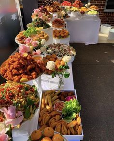 a buffet table filled with different types of food