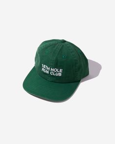 16th Hole Run Club Dad Hat – Green Top off your look with the bold, rebellious spirit of the 16th Hole Run Club in the Green Dad Hat. Inspired by the electric energy of the 16th hole at TPC Scottsdale’s Waste Management Open, this hat is designed for those who live for the thrill of the run and the unforgettable moments on the course. Made from durable cotton with an adjustable strap, this classic dad hat delivers a comfortable fit and effortless style. Whether you're hitting the pavement for a Cheap Adjustable Green Snapback Hat, Cheap Green Hats With Embroidered Logo, Waste Management Open, Vintage Golf, Morning Running, Golf Hats, Golf Training, White Paneling, Dad Hats