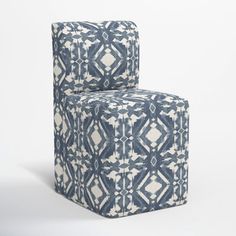 a blue and white patterned chair on a white background