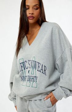 The Pacific Sunwear 1980 LA V-Neck Sweatshirt from PacSun offers a cozy and stylish look. Featuring a v-neckline, long sleeves, ribbed trimming, Pacific Sunwear Ninety Eighty front and wrist embroidery, and an oversized fit, this sweatshirt is perfect for casual, laid-back days.Solid color sweatshirtSoft fleece liningV-necklineLong sleevesDropped shouldersRibbed trimmingFront embroideryOversized fitModel is wearing a size XS/S60% cotton, 40% polyesterMachine washableModel measurements: 5’5” height, 31” bust, 23” waist, 36” hips PacSun Womens Pacific Sunwear 1980 LA V-Neck Sweatshirt - Grey size M/L High Waisted Sweatpants, Pacific Sunwear, Town Center, Ankle Cuffs, Women Hoodies Sweatshirts, The Pacific, Drawstring Waistband, Grey Sweatshirt, Pacsun