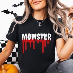 👉 Momster and Dadcula Shirt, Halloween Parents Shirt ➡️Features: - 100% Airlume combed and ringspun cotton - These t-shirts have-ribbed knit collars to bolster shaping. - Printed and shipped from the USA ✨HOW TO ORDER✨ 1) Please, check and review all photos 2) Choose your sweatshirt or t-shirt style, color, and size 3) Click add to cart. You can go back and follow the same steps to add more items to your cart 4) Click "Proceed to check out" 5) Add your shipping address and choose your shipping Funny Pre-shrunk Shirt For Halloween, Halloween Novelty Shirt With Letter Print, Novelty Halloween Shirt With Letter Print, Black Horror Shirt For Halloween, Funny Halloween Shirt With Letter Print, Funny Halloween Letter Print Shirt, Red Graphic Print Shirt For Halloween, Red Shirt With Graphic Print For Halloween, Halloween Red Short Sleeve Shirt