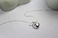 This fabulous heart shape locket with sparking CZ moon necklace is so unique but at the same time looks absolutely simple and timeless. When folded it has a shape of a heart that opens into a clover. This locket heart with moon star jewelry makes a perfect gift for a mom, grandmother and is an ideal gift for sweetheart photos. Lovely keepsake to keep or give as a gift. * 925 silver chain and clasp * Adorable Glossy Silver plated CZ north star, 24x28mm small star 7 mm . locket 13 mm Necklace Size Moon Locket Necklace, Elegant Heart-shaped Moon Charm Jewelry, Elegant Heart-shaped Jewelry With Moon Charm, Locket Necklace Heart, Necklace Heart Locket, Moon Locket, Pic Photo, Jewelry Heart, Heart Locket Necklace