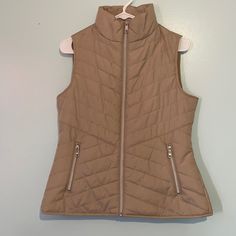 Semi Puffer Vest. Nwot. Color Is True To First Photo. Cream/Tan. Size Small. 23.5 Inches- Length 18 Inches- Pit To Pit Feel Free To Make A Reasonable Offer Beige Fitted Vest Outerwear, Beige Single-breasted Vest For Spring, Casual Beige V-neck Vest, Cheap Beige V-neck Vest, Beige Button-up Vest With Button Closure, Puffer Vest, First Photo, Puffer, Jackets & Coats