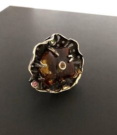 ARTISAN AMBER RINGHand-made Sterling Silver. Size 8-8 1/2Stones used: Baltic Amber, Green&Pink Tourmaline, Yellow Sapphire.  Face of the ring : Height – 35mm, Width-35mm                             Height -  1 3/8“, Width – 1 3/8“Stone size on the ring face – Height-27mm, Width-24mm.It is a very Unique Ring - a Spinner Ring, You can spin it around and wear any way you want.Unique Handcrafted One-of a-kind Design Ring.Each Piece of Jewelry in my Collection is One of a kind.When you start wear Luxury Amber Sterling Silver Rings, Unique Amber Sterling Silver Rings, Unique Amber Rings For Formal Occasions, Formal Amber Rings, Unique Multi-stone Sterling Silver Rings, Luxury Handmade Amber Rings, Fusion Style Polished Finish Rings As Gift, Luxury Amber Rings As Gifts, Luxury Amber Ring As Gift