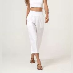 Elevate Your Fashion Game With These Zinzane Wide Leg Cropped Palazzo Pants. Perfect For Any Occasion, These Pants In A Refreshing White Color Are A Must-Have In Your Wardrobe. The Pants Are Designed In A Size Small For Women With A Regular Size Type. Made From High-Quality Materials, These Pants Are Comfortable And Stylish. The Cropped Length And Wide Leg Design Make Them Perfect For Pairing With Sandals Or Heels. The Pants Feature A Trendy Crop Style And Are Perfect For Any Season. Add These P High Waist Capris For Summer Loungewear, White Capris For Summer, White Casual Capris For Beach, White Pants With Elastic Waistband For Vacation, White Capris With Elastic Waistband For Summer, Casual White Capris For The Beach, White Elastic Waistband Pants For Vacation, Casual White Capris For Beach, White Casual Beach Capris