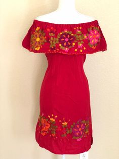 "Mexican Off the shoulder tie back dress. With beautiful hand embroidery.Made out of manta, 100% cotton. Color: Red/ Multicolored embroidery. Size- Medium Dimensions: Bust- 43\" Hips- 43\" Waist- 43\" Length- 31\" 🧵Made in Chiapas, Mexico. 🧺Care Instructions: We recommend hand washing, lay flat to dry. 📲Please feel free to message me with any questions regarding sizing and fit. 📷Additional photos can be provided upon request. 👗Always allow a little room and consider your own measurements be Red Sleeveless Dress With Intricate Embroidery, Traditional Off-shoulder Embroidered Dress, Fitted Festival Dress With Embroidered Border, Peasant Style Red Embroidered Dresses, Fitted Dress With Embroidered Border For Festival, Bohemian Red Off-shoulder Dress, Red Bohemian Off-shoulder Dress, Peasant Style Festival Dress With Embroidered Border, Red Sundress With Floral Embroidery