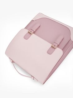 The Verbena Vintage Laptop Backpack highlights a multi-functional design that embodies modern vintage. Its structured spacious silhouette in pastel pink vegan leather with delicate flap & gold-tone hardware enhances the timeless beauty. The front and back pockets can help carry daily essentials. Besides, the back pocket can be opened from the bottom so you can attach your bag to the luggage when traveling. With detachable and adjustable shoulder straps, this vegan vintage bag for women can be ca Pink Satchel For Business, Pink Business Satchel Shoulder Bag, Pink Satchel Shoulder Bag For Business, Pink Satchel With Detachable Strap Backpack, Pink Satchel With Detachable Strap, Backpack Style, Modern Pink Rectangular Satchel, Modern Pink Shoulder Bag For Business, Pink Satchel For School, Pink Laptop Bag For School