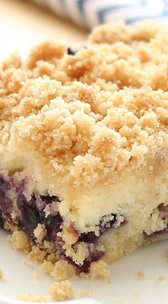 a piece of blueberry crumb cake on a plate