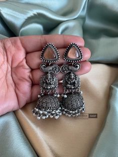 Lakshmiji oxidised Earrings / Indian earrings / German silver earrings / Statement earrings / Pakistani Earrings/ oxidised earrings Best use for gifting purposes. It can be wore on any occasion and with any outfit. You can gift this to your sister as Diwali gift  OCCASION: PARTY WEAR, WEDDING, MARRIAGES, CASUAL, DAILY WEAR These Earrings set have an excellent finish Ideal Gift Idea: Perfect beautiful & memorable gift for you and your loving wife, girlfriend, sister, aunt, daughter, and mom/mothe Oxidized Finish Dangle Earrings As A Gift, Oxidized Finish Dangle Earrings For Gift, Antique Finish Earrings For Festivals Gift, Antique Finish Earrings For Festivals And Gifts, Wedding Earrings With Oxidized Metal Finish, Fusion Style Silver Danglers With Oxidized Finish, Silver Fusion Style Metal Danglers, Silver Metal Fusion Danglers, Silver Fusion Danglers Made Of Metal