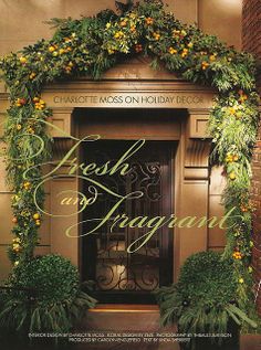 an advertisement for fresh and tangerines with oranges on the front door, surrounded by greenery