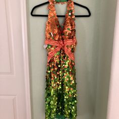 Dazzling Never Worn Terani Coral And Green Sequin Halter Dress. Nwt Size 6 Orange Sleeveless Dress For Holiday, Orange Spring Holiday Dresses, Green Summer Costume Dress, Green Sequined Dresses For Costume Party, Orange Sequined Summer Dress, Orange Sequin Summer Dress, Multicolor Summer Costume Dress, Orange Dress For Costume Party, Orange Halloween Costume Dress