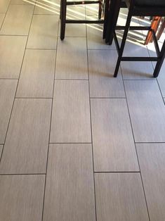 a kitchen floor that has some chairs on it