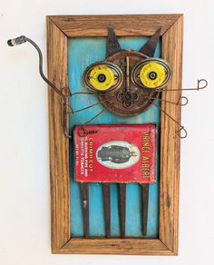 a cat made out of wood with goggles on it's eyes and head