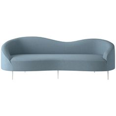 a blue couch sitting on top of a white floor