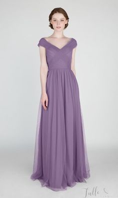 a woman in a long purple dress