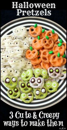 halloween pretzels on a plate with green and orange candies in the middle