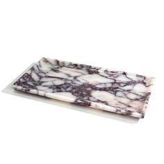 a white and brown marble plate on a white background