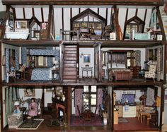 a doll house with many rooms and furniture