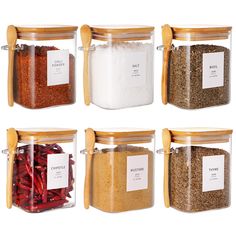 six jars with spices in them are labeled salt, chili, seasoning, and sauerkraut