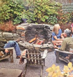 a man sitting in a chair next to a fire pit